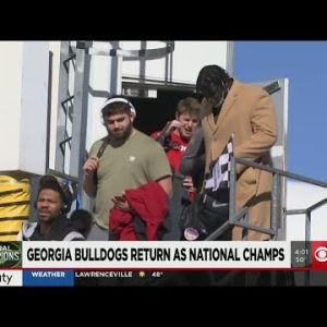 University of Georgia football players arrive in Georgia