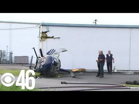 No injuries after helicopter crashes into building in Calhoun